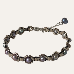 Delicate beaded bracelet with blue freshwater pearl and metallic steel toned glass beads