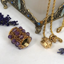 Load image into Gallery viewer, Facetted amethyst and fine metallic gold glass bead encrusted tiny urn pendant. Lock of hair keepsake. Cremation jewellery. On twisted French steel chain.