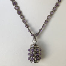 Load image into Gallery viewer, Amethyst encrusted tiny urn locket. Finely beaded with metallic steel micro-beads and amethyst gemstone. Cremation jewellery. Lock of hair keepsake.