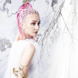 Nouveau romantic punk model wears baroque pearl drop earrings