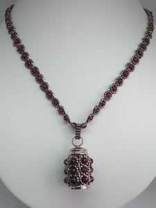 Cremation jewellery. Garnet encrusted fine beaded urn pendant on garnet and metallic bronze beaded chain