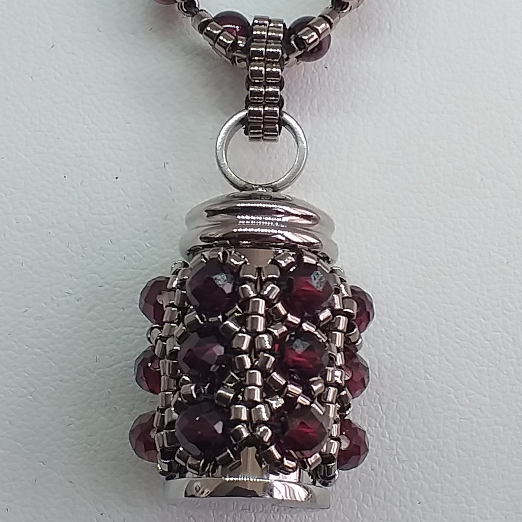 Cremation jewellery. Garnet encrusted fine beaded urn pendant on garnet and metallic bronze beaded chain