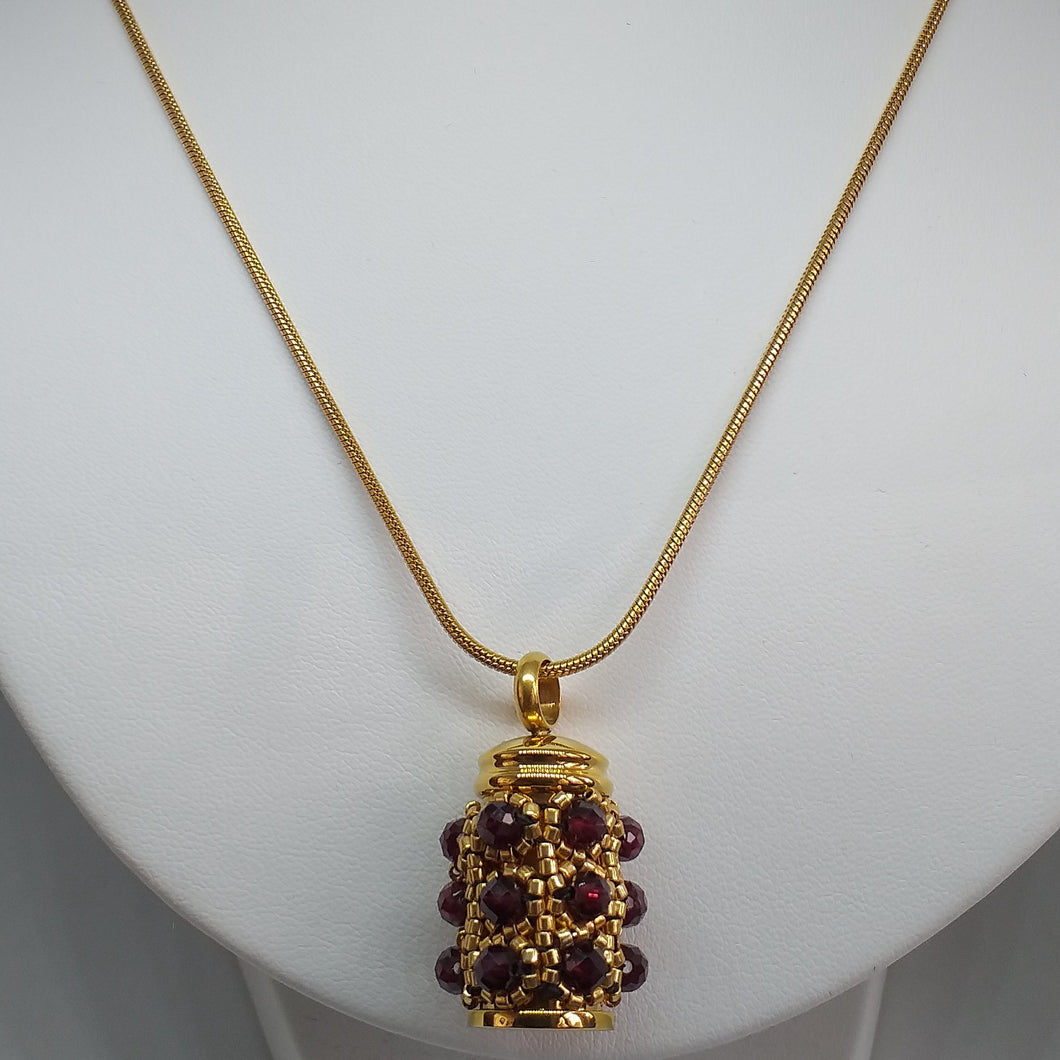 Facetted garnet and fine metallic gold glass bead encrusted tiny urn pendant. Lock of hair keepsake. Cremation jewellery.