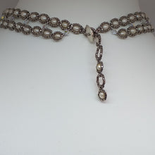 Load image into Gallery viewer, V shaped fine beaded pearl necklace with metallic micro-beads and Swarovski crystal. Adjustable toggle closure at the back.