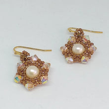 Load image into Gallery viewer, Fine beaded snowflake earrings with freshwater pearl centerpiece circled by a mandala of metallic micro-beading and Swarovski crystal