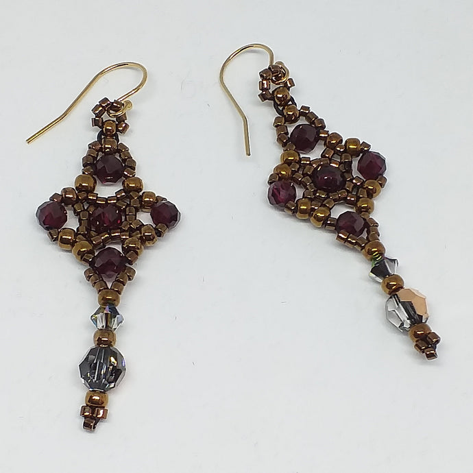 Celtic cross shape beaded earrings with facetted garnet and Swarovski crystal in metallic bronze theme micro-beading