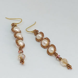 Pearl drop earring with 3 pearls and a Swarovski crystal drop. Fine beaded with metallic glass micro-beads