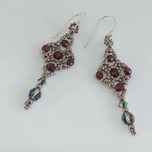 Celtic cross shape beaded earrings with facetted garnet and Swarovski crystal in metallic silver theme micro-beading