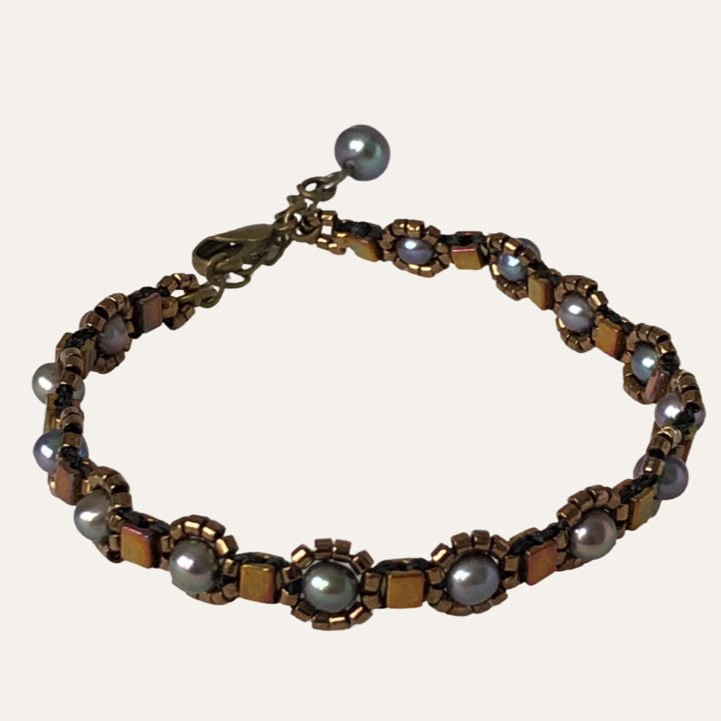 Delicate beaded bracelet with freshwater pearl and metallic bronze toned glass beads
