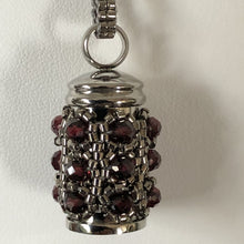 Load image into Gallery viewer, Facetted garnet and fine metallic steel glass bead encrusted tiny urn pendant. Lock of hair keepsake. Cremation jewellery.