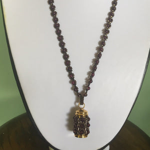 Cremation jewellery. Garnet encrusted fine beaded urn pendant on garnet and metallic bronze beaded chain