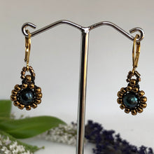 Load image into Gallery viewer, Beaded pearl earrings with bronze-tone glass beads circling a freshwater black pearl on lever-back steel wires