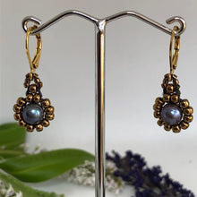 Load image into Gallery viewer, Beaded pearl earrings with bronze-tone glass beads circling a blue freshwater pearl on lever-back steel wires