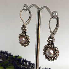 Load image into Gallery viewer, Beaded pearl earrings with silver-tone glass beads circling a freshwater pearl on lever-back steel wires