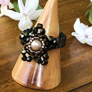 Beaded ring in the shape of a star with freshwater pearl centerpiece and mat metallic beaded band. Stunning!