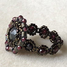 Load image into Gallery viewer, Fine beaded ring with facetted labradorite centerpiece and garnet mandala surround with garnet beaded band. Dark metallic bronze micro-beading