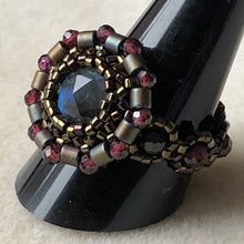 Load image into Gallery viewer, Fine beaded ring with facetted labradorite centerpiece and garnet mandala surround with garnet beaded band. Dark metallic bronze micro-beading