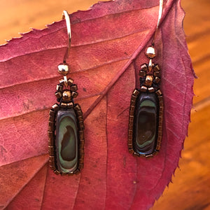 Paua earrings: Paua/Abalone shell flute surrounded by metallic glass micro-beads