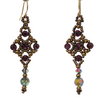 Load image into Gallery viewer, Celtic cross shape beaded earrings with facetted garnet and Swarovski crystal in metallic bronze theme micro-beading